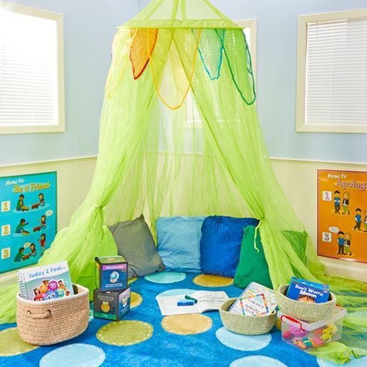 Cozy preschool classroom calm down corner with soft pillows and rug