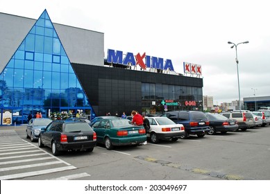 Maxima Lithuania modern supermarket exterior sunny day