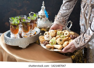 Moroccan cookies on a tray with tea glass authentic