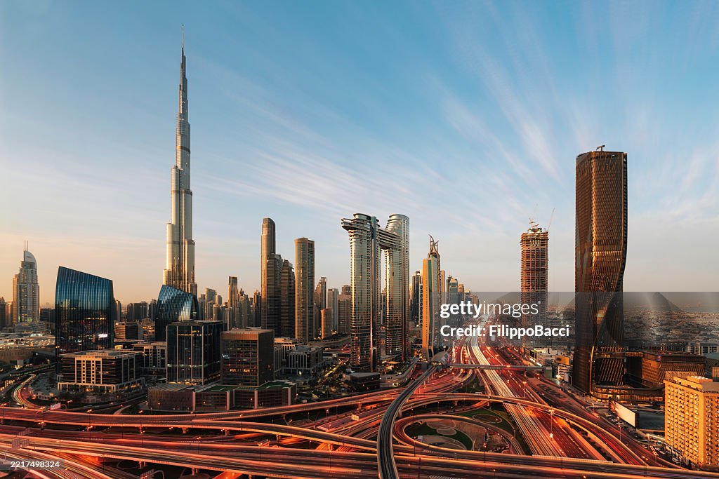 Aerial view of Dubai skyline at sunset with Burj Khalifa, corporate style, high resolution, minimalist