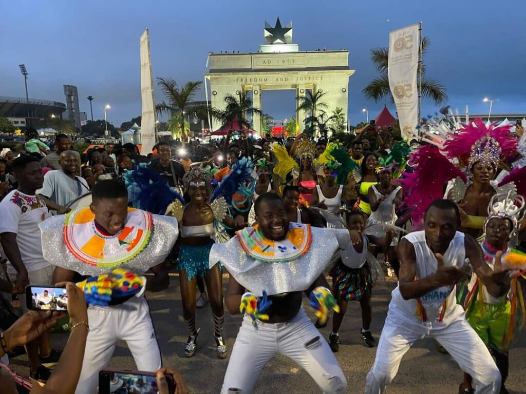 Colorful Caribbean carnival dancers in the streets of Ghana