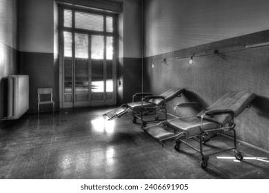 worn out fabric waiting room chair in a hospital hallway, slightly dirty upholstery, realistic photography