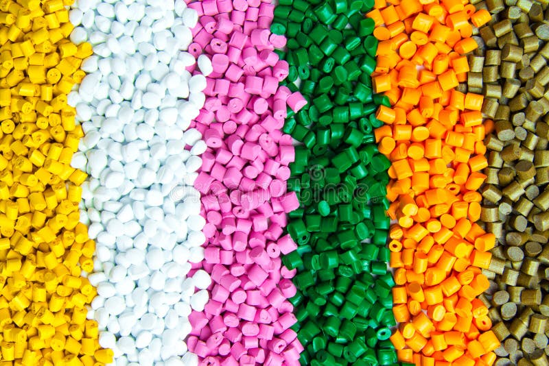 Plastic granules pellets texture close up, colorful or industrial raw material for injection molding
