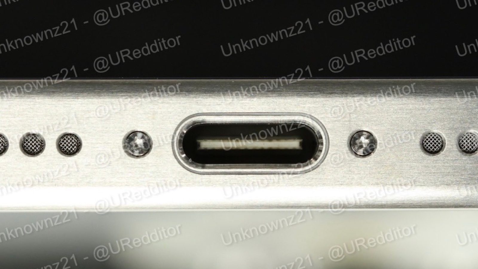 USB-C port close up on iPhone titanium frame
