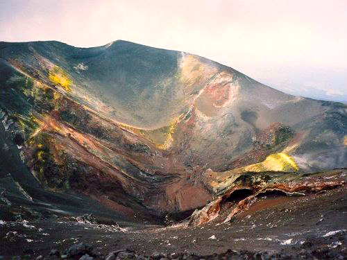Aerial photography of Valle del Bove Etna, vast barren volcanic depression filled with black lava flows