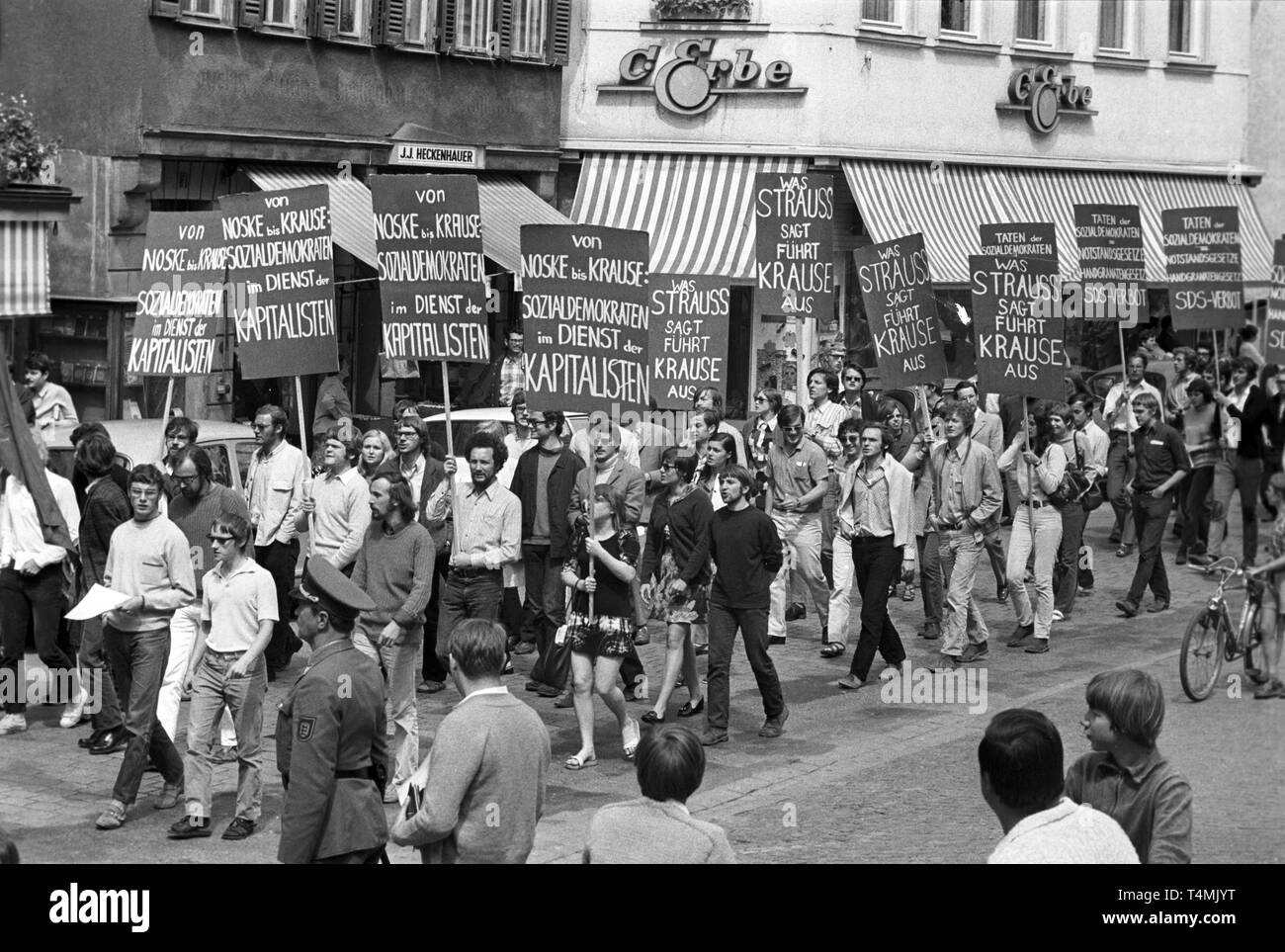 Student protests Germany 1970s black and white historical photo banner slogans