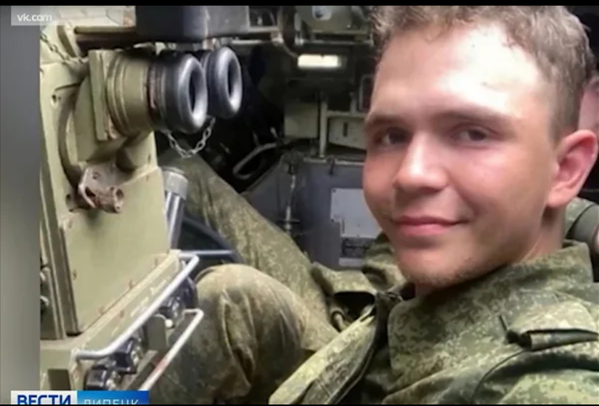 Cinematic scene of an armored personnel carrier moving through a rugged terrain field, dust and tense atmosphere, realistic military style without gore