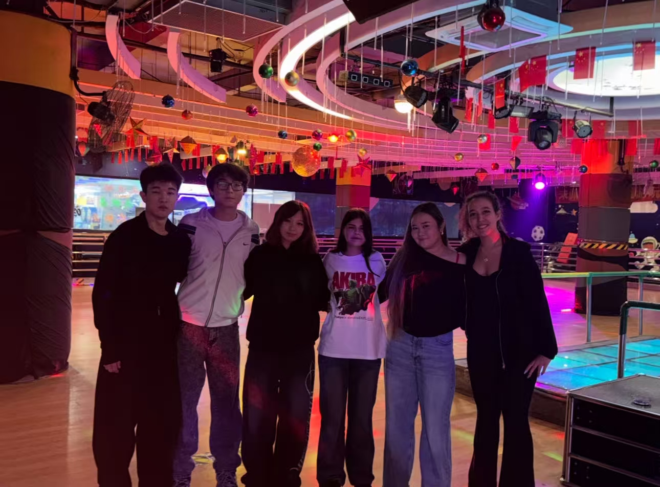 Cozy atmosphere, group of young students sitting in a circle in a cafe drinking tea and laughing, warm lighting, blurred background